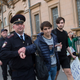 A Russian police officer detains a gay rights activist at the US Embassy in Moscow.